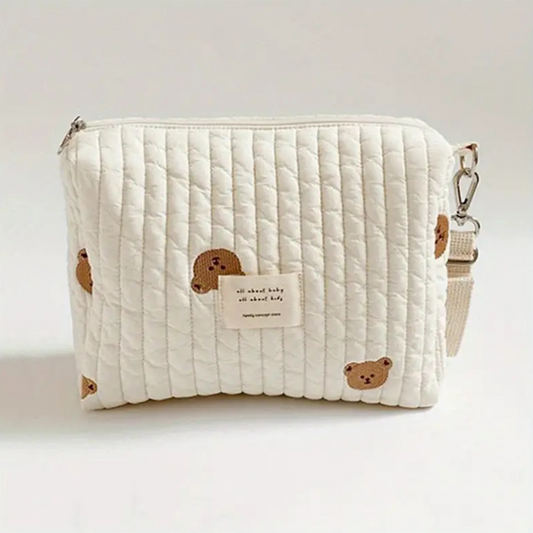 Trousse à langer portable en coton bio pour poussette - Design ours. Pratique et écologique, parfaite pour organiser les essentiels de bébé lors des sorties.
